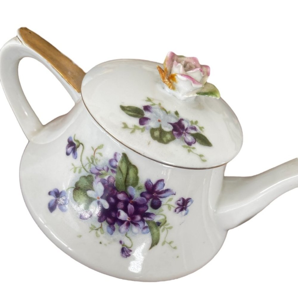 vintage porcelain teapot with purple pansy's + teacup